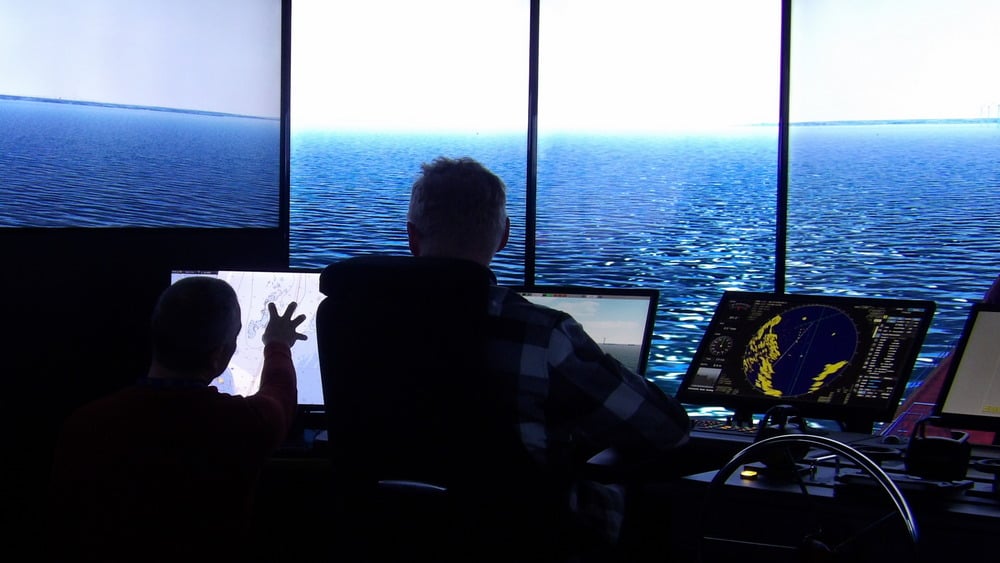 Two male operatives testing bridge equipment in SAMK’s maritime simulators in Rauma, Finland. (Photo: SAMK)